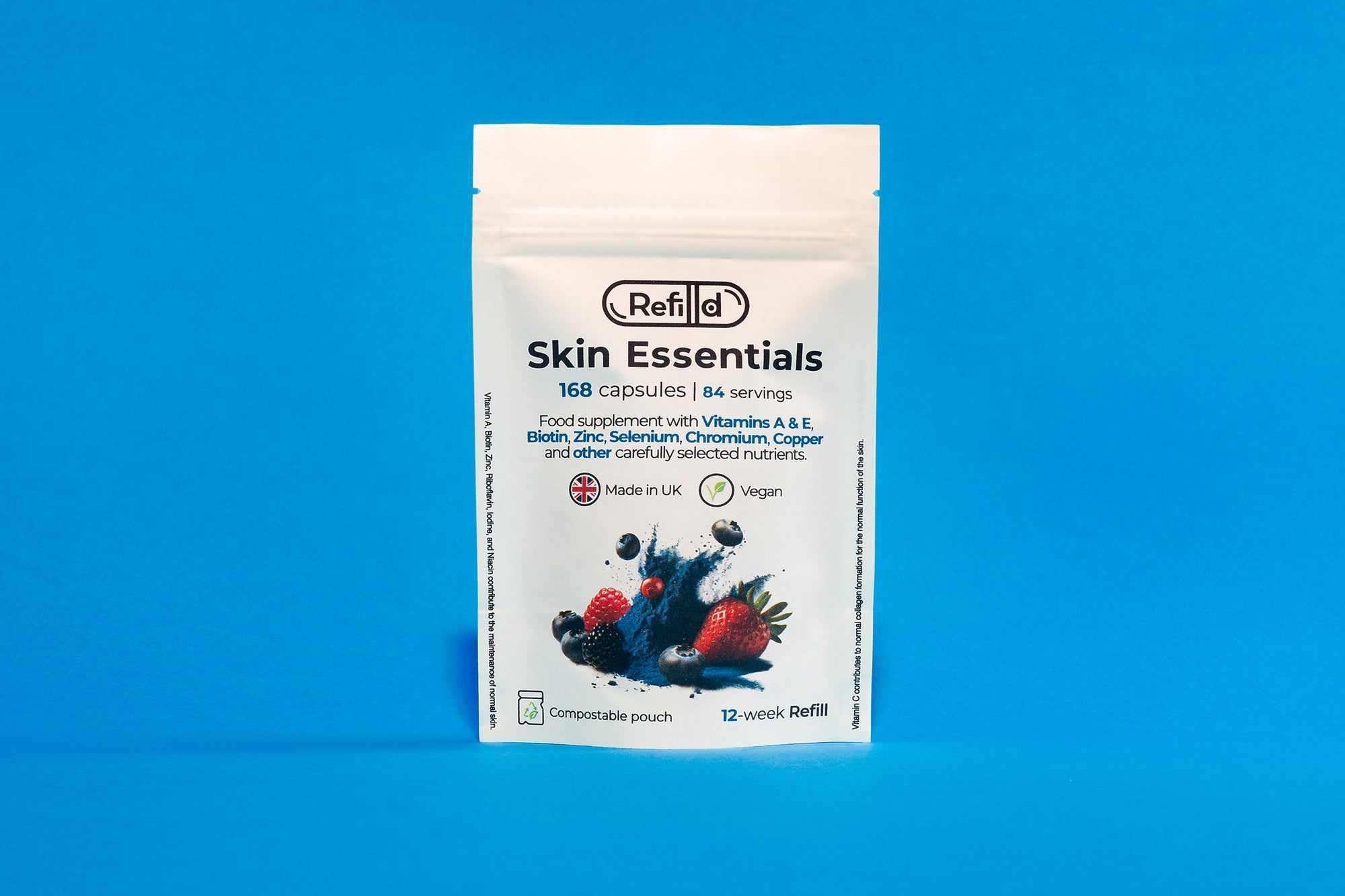 Refilld Skin Essentials compostable refill pouch for a 12-week supply, displayed on a blue background. Refilld Skin Essentials, compostable refill pouch, 12-week supply, eco-friendly packaging, blue background