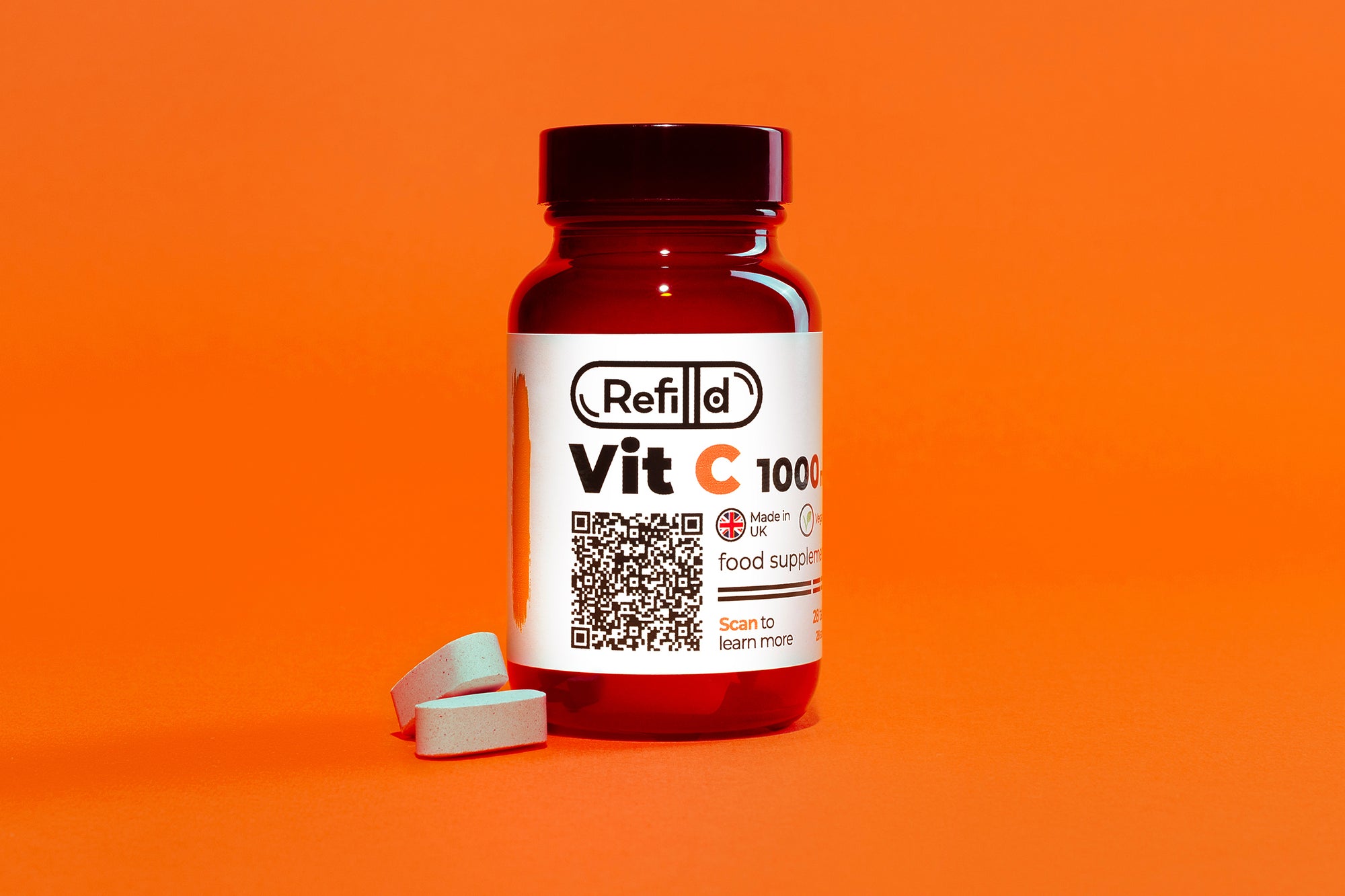 Refilld Vit C 1000 mg bottle with tablets, displayed on an orange background.
Refilld Vit C 1000 mg, food supplement, vitamin C, tablets, orange background, immunity support