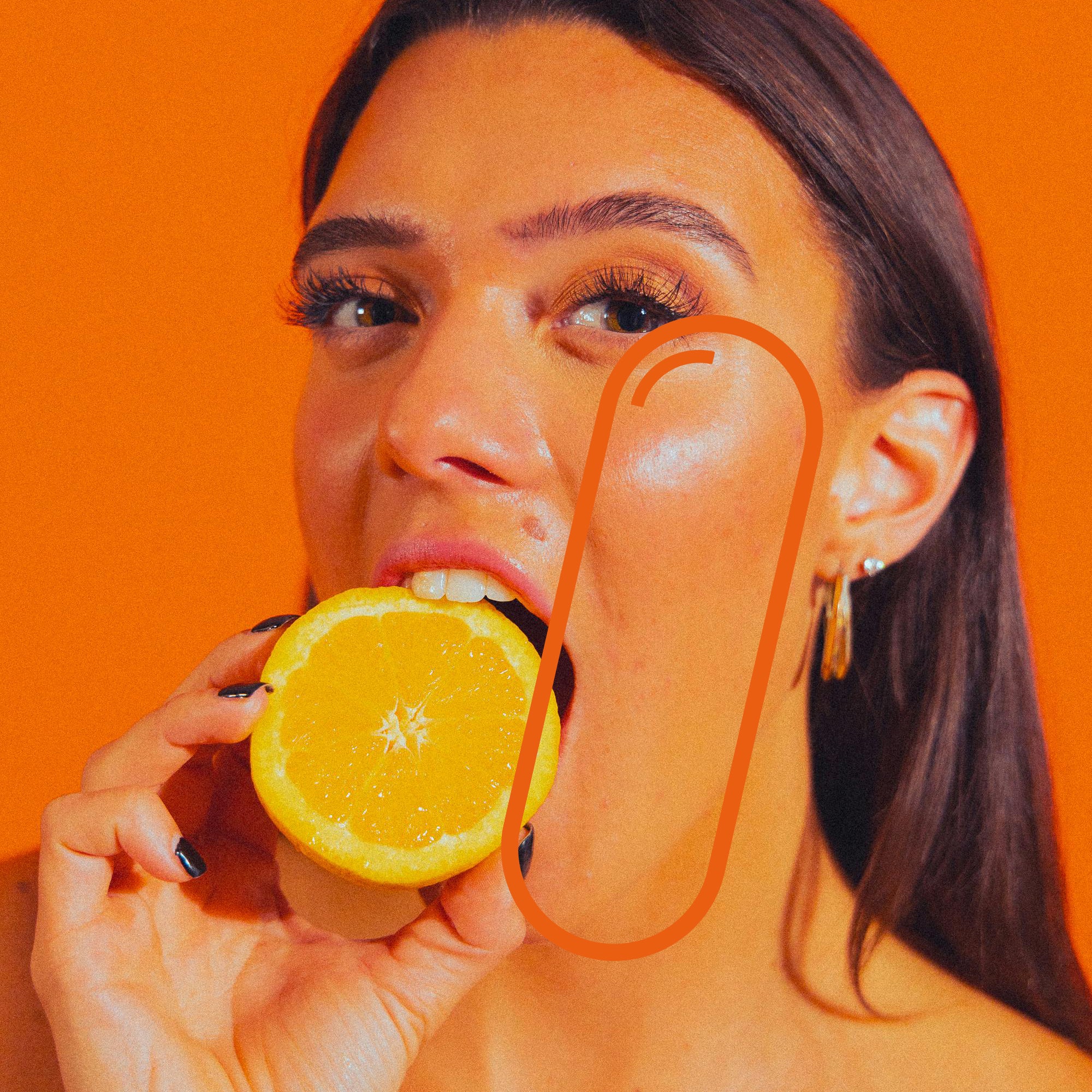 A young person biting into a fresh orange, Vitamin C intake for immune support, vibrant lifestyle.