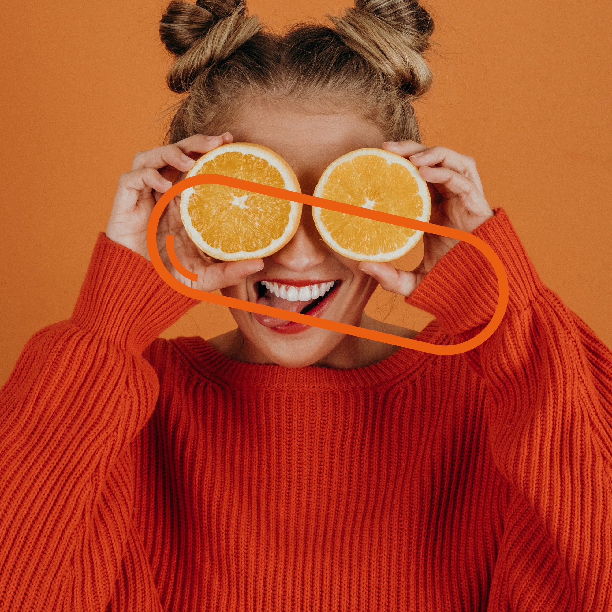 A cheerful person holding orange slices over their eyes. Vitamin C boosts the immune system, fun with antioxidants.